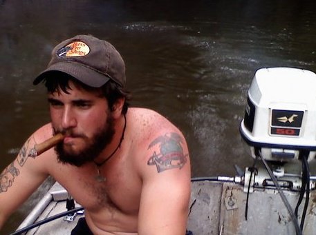 Man smoking cigar in the swamp
