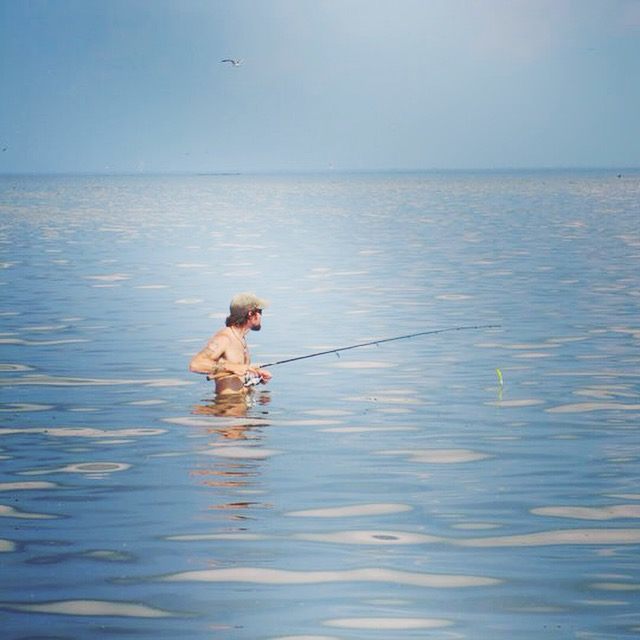 Angler wade fishing for speckled trout