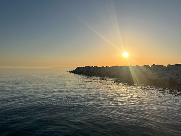 fourchon barges rock pile at sunrise fourchon barges rock pile at sunrise