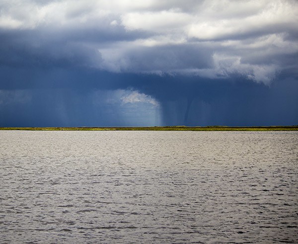 waterspout over marsh waterspout over marsh